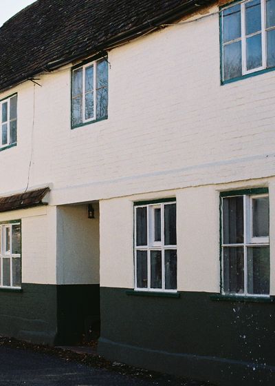 residential exterior painting - beige stucco two-story home