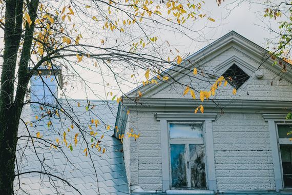 freshly painted beige stucco two-story home exterior